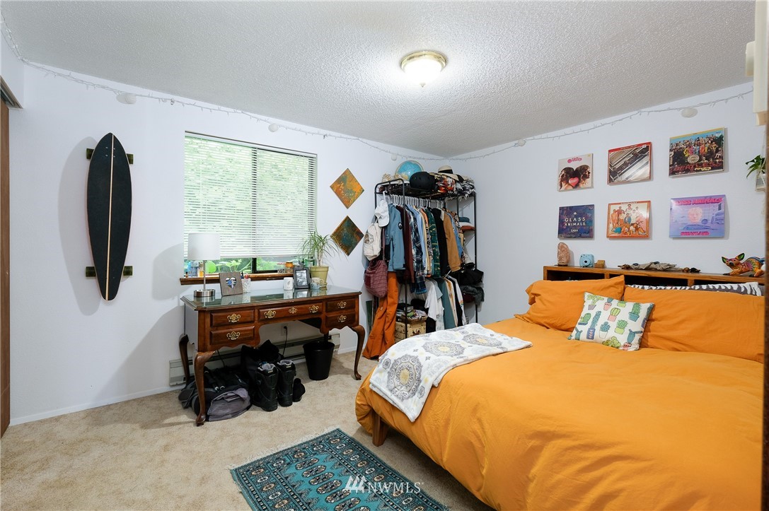 2734 Pine Road Northeast Bremerton, WA 98310 - Photo 13 of 17 a bed room with a bed and a desk