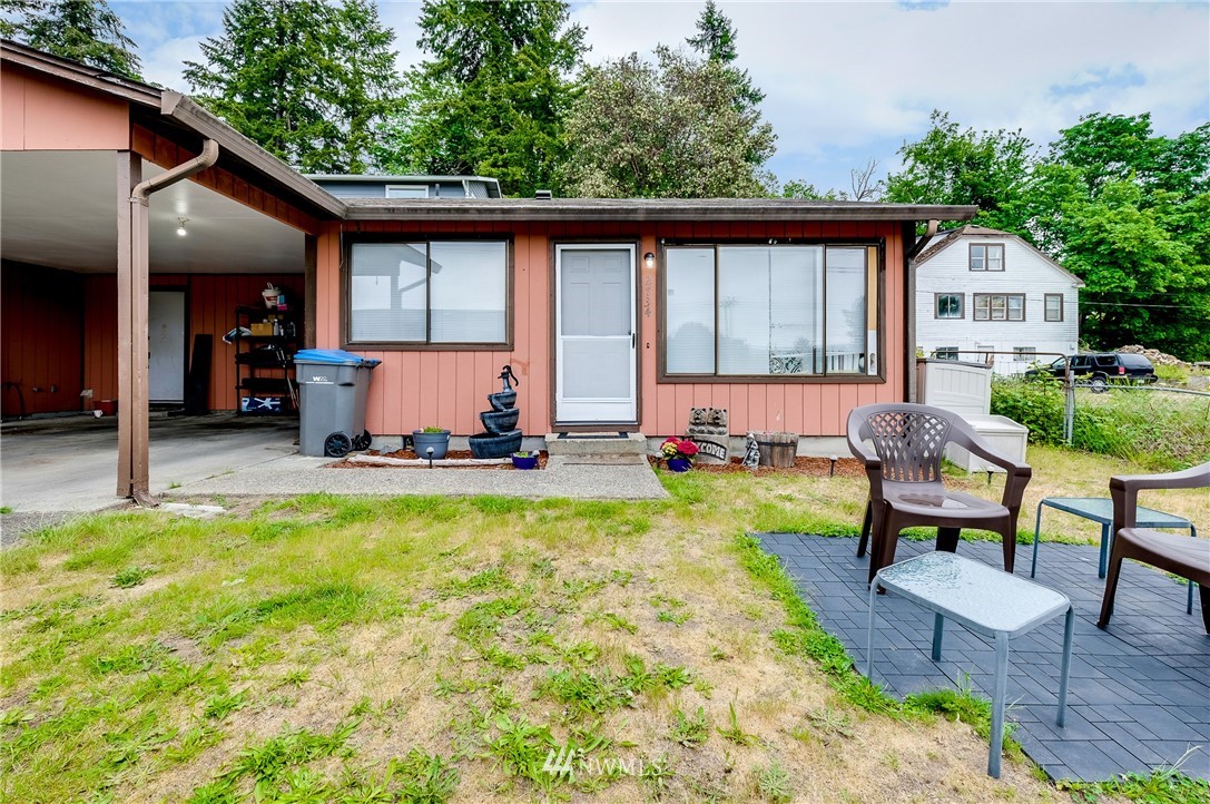 2734 Pine Road Northeast Bremerton, WA 98310 - Photo 3 of 17 a view of swimming pool with lawn chairs and a yard
