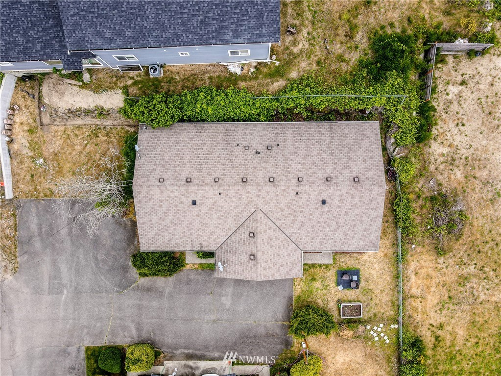 2734 Pine Road Northeast Bremerton, WA 98310 - Photo 4 of 17 an aerial view of a house with a yard