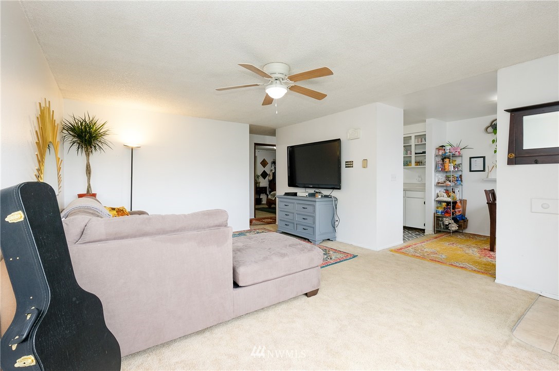 2734 Pine Road Northeast Bremerton, WA 98310 - Photo 6 of 17 a living room with furniture and a flat screen tv