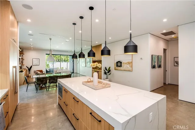 a work room with furniture and a large window