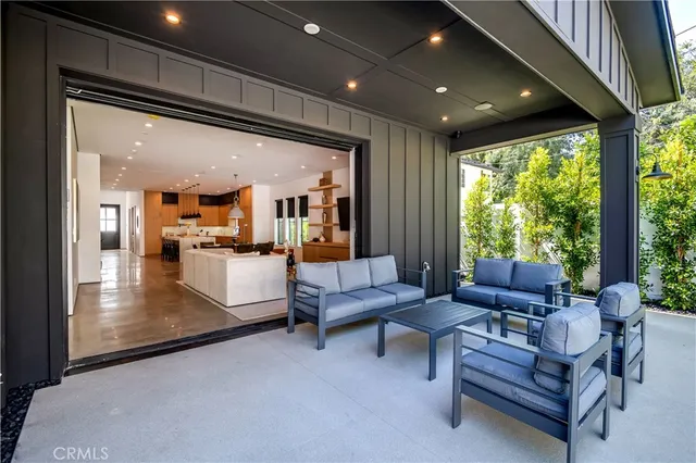 a living room with fireplace furniture and a flat screen tv