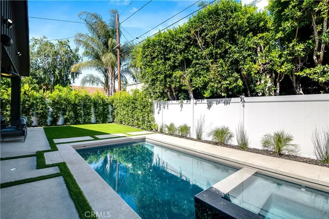 a bathroom with a bathtub and a vanity
