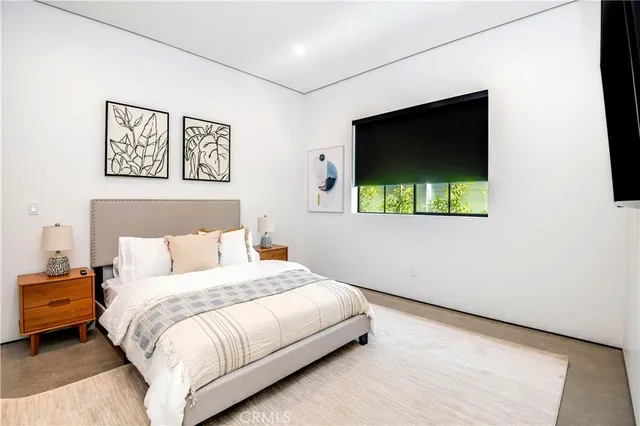 a view of a hallway with a view of living room