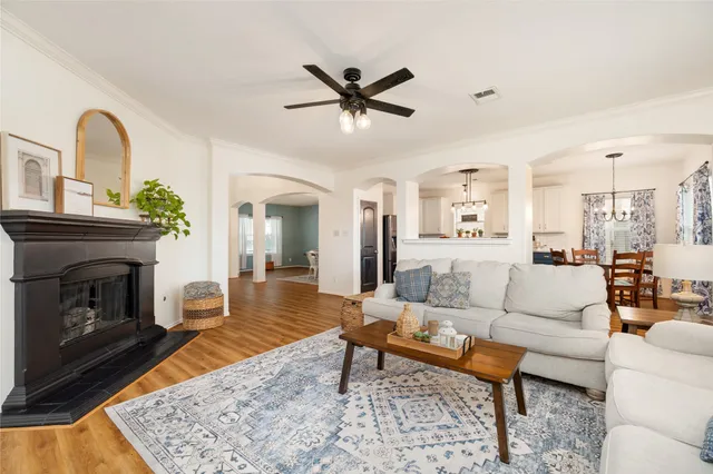 a living room with furniture and a fireplace