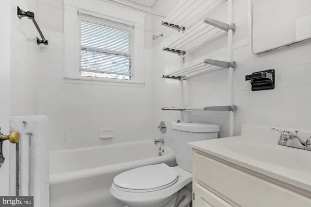 a bathroom with a toilet sink and shower