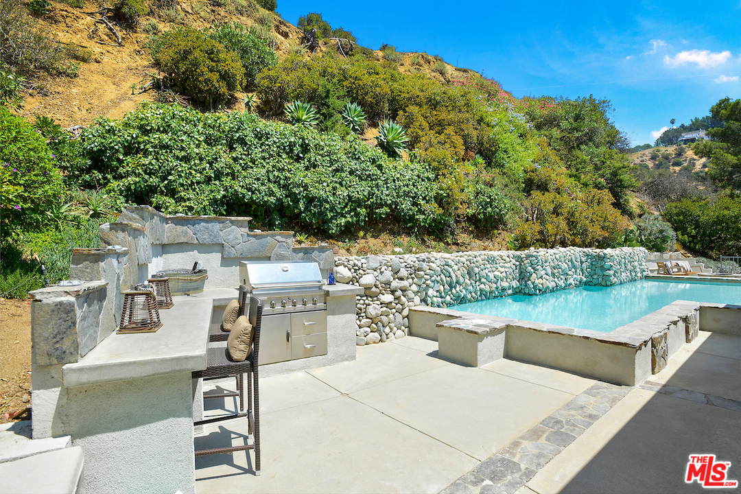 9573 Stuart Lane Beverly Hills, CA 90210 - Photo 20 of 24 a view of a terrace with furniture and outdoor space