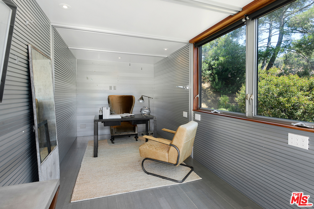 9573 Stuart Lane Beverly Hills, CA 90210 - Photo 23 of 24 a living room with furniture and a window
