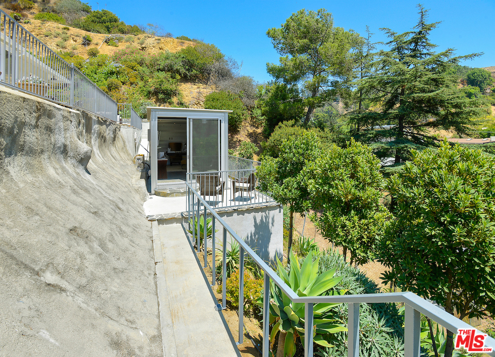 9573 Stuart Lane Beverly Hills, CA 90210 - Photo 24 of 24 a view of balcony with furniture and potted plants