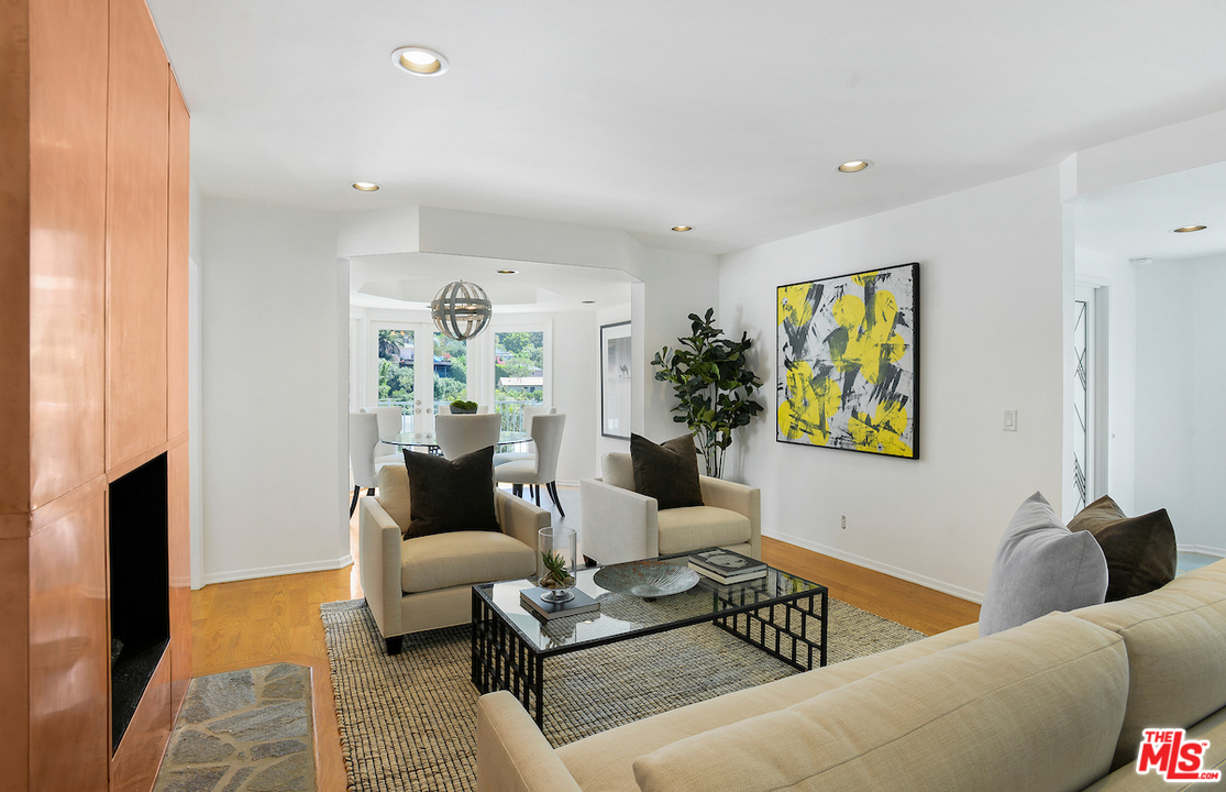 9573 Stuart Lane Beverly Hills, CA 90210 - Photo 4 of 24 a living room with furniture and painting on the wall