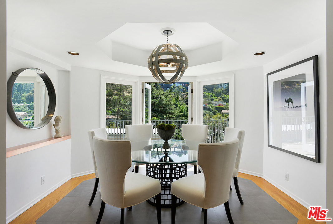 9573 Stuart Lane Beverly Hills, CA 90210 - Photo 5 of 24 a view of a dining room with furniture window and outside view