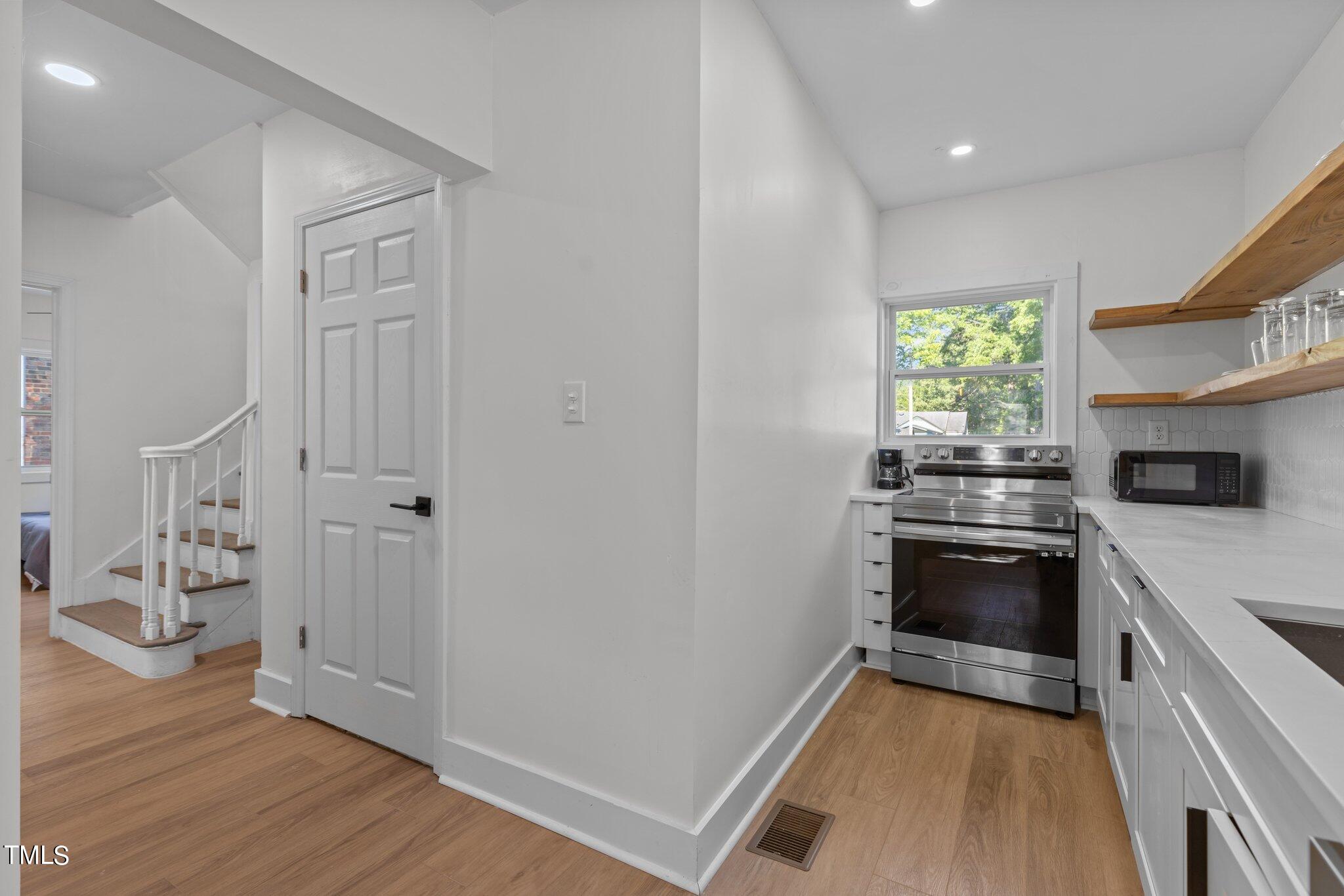 2707 North Roxboro Road Durham, NC 27704 - Photo 14 of 41 behind door is full bath