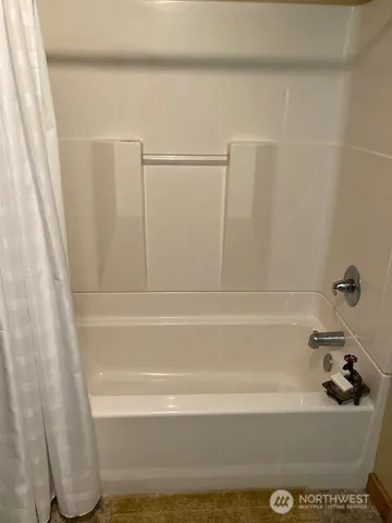 a view of a swimming pool with a yard