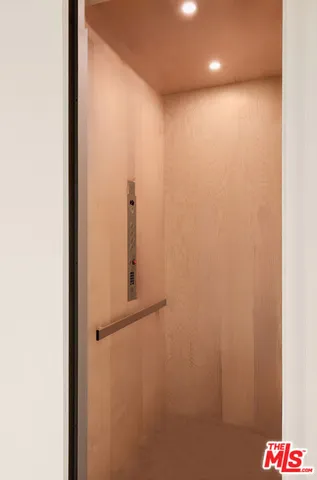 a bathroom with a shower and a sink