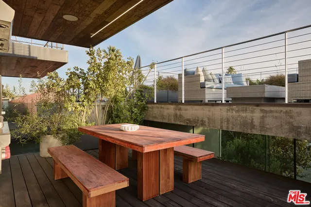 a view of a chairs and table in the patio