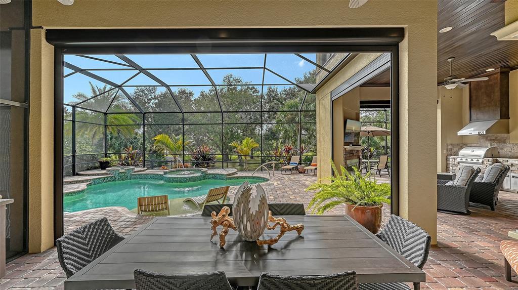 9489 Swaying Branch Road Sarasota, FL 34241 - Photo 22 of 37 a view of a porch with furniture and garden