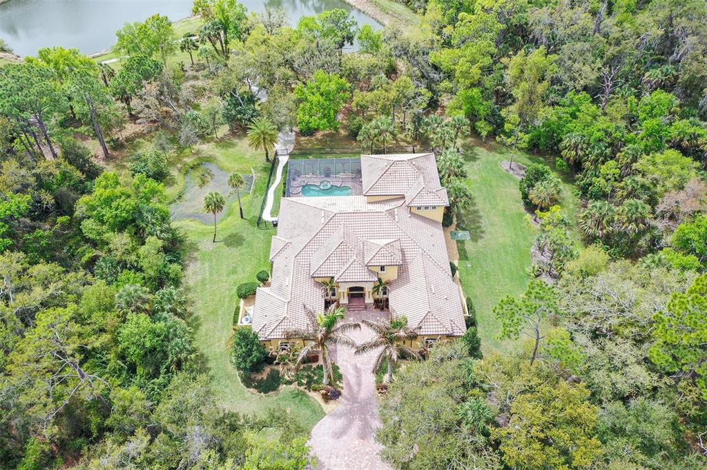 9489 Swaying Branch Road Sarasota, FL 34241 - Photo 27 of 37 an aerial view of residential house with outdoor space and trees all around