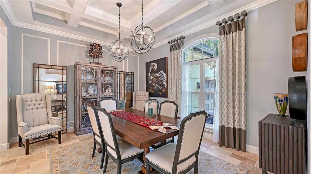 9489 Swaying Branch Road Sarasota, FL 34241 - Photo 6 of 37 a view of a dining room with furniture a chandelier and wooden floor