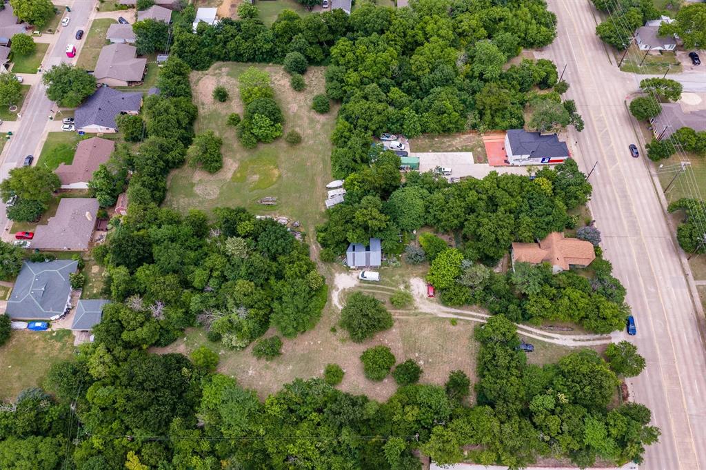 1007 West Belt Line Road Cedar Hill, TX 75104 - Photo 6 of 30 Expansive lot featuring mature trees and clearings, providing diverse landscaping opportunities