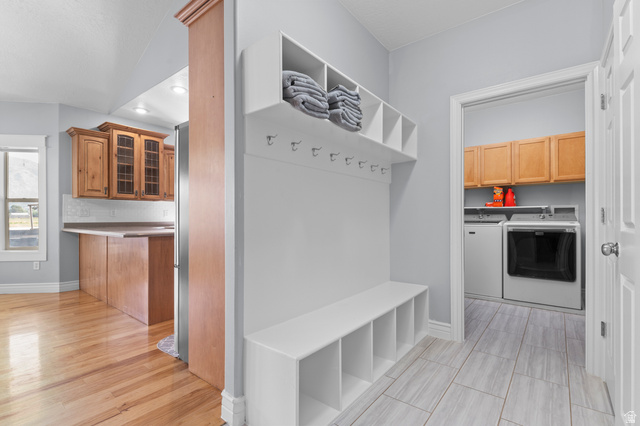 1501 West Elk Circle Mapleton, UT 84664 - Photo 20 of 39 Entryway featuring a built-in bench with cubbies, overhead shelving, and coat hooks