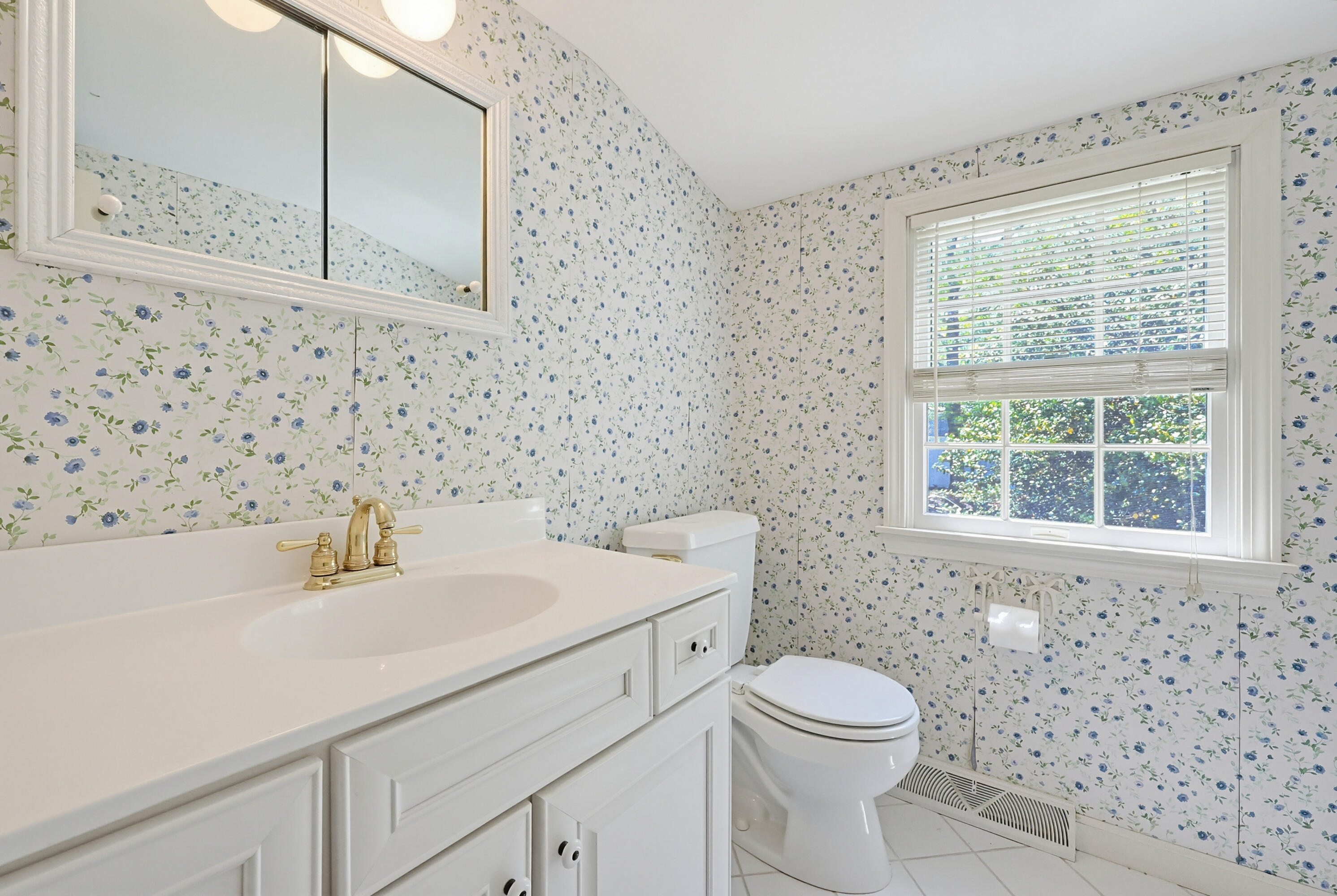 556 Cotuit Road Mashpee, MA 02649 - Photo 25 of 45 a bathroom with a sink a toilet and a mirror