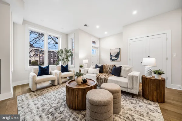 a living room with furniture or couch and a potted plant