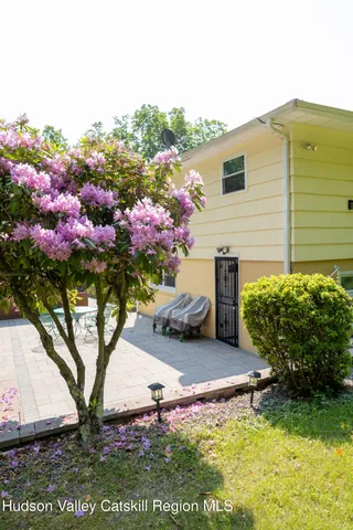 a front view of a house with yard