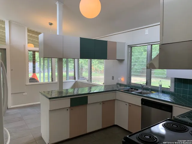 a kitchen with a sink and a window