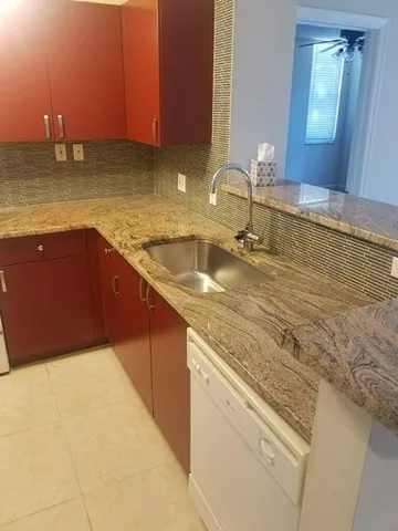 a kitchen with a sink and cabinets