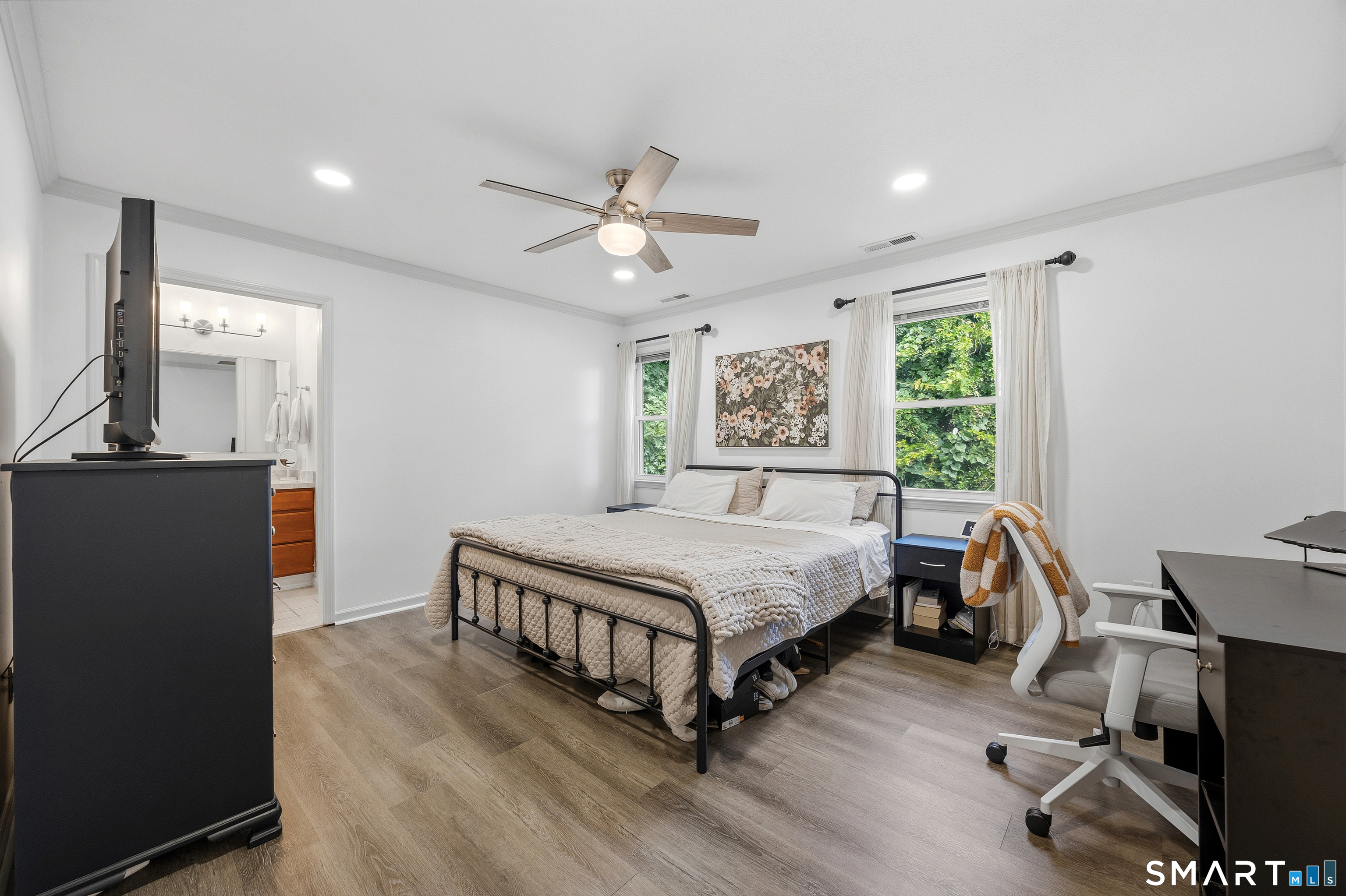 55 Mill Plain Road, Unit 121 Danbury, CT 06811 - Photo 16 of 33 The Primary Bedroom Suite is approximately 12' X 15' offering ample space for a king size bed. The room features a large walk-in closet and is en suite.