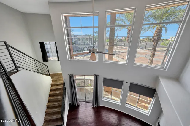 a view of an entryway with wooden floor and door