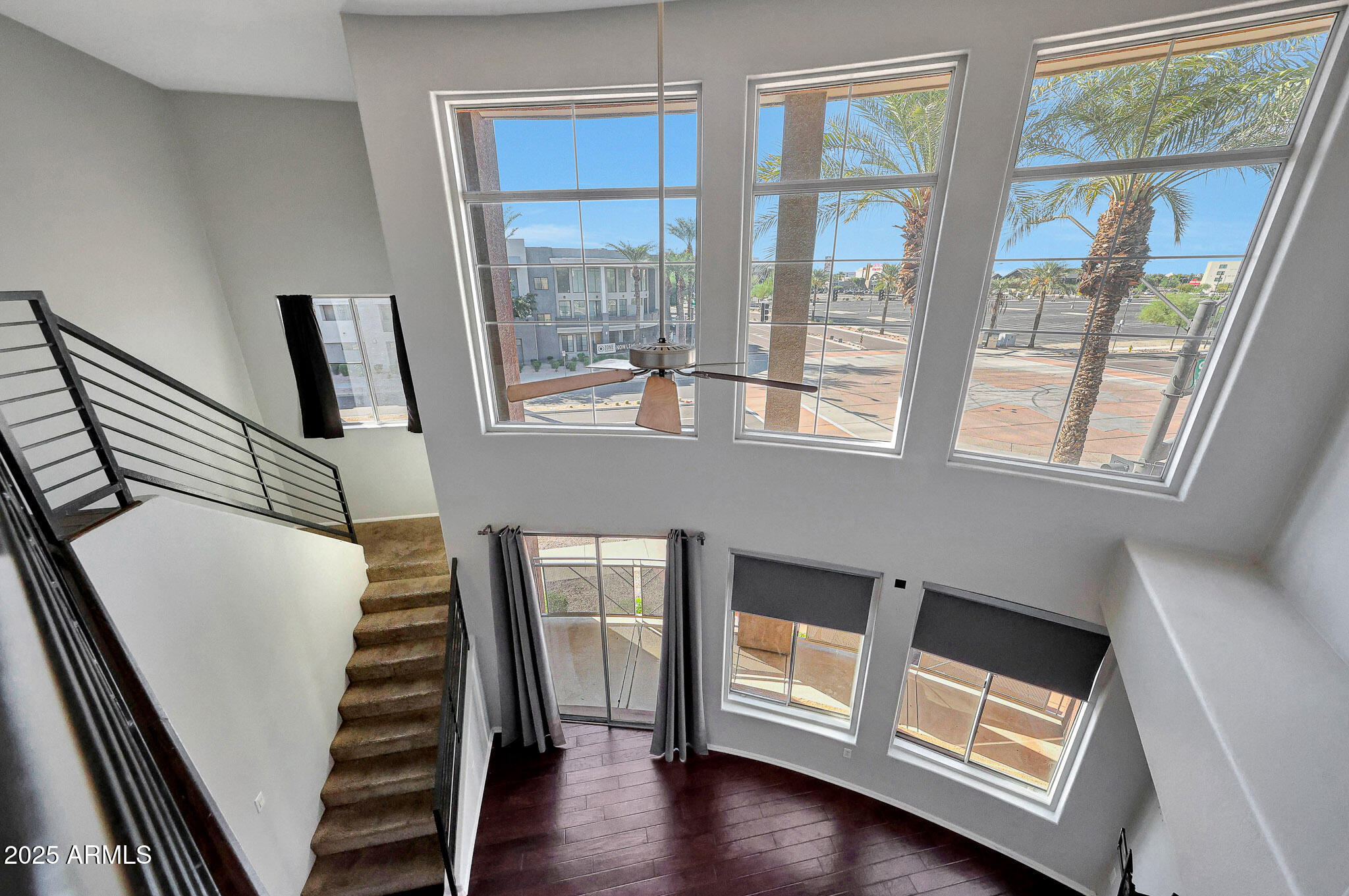 6605 North 93RD Avenue, Unit 1067 Glendale, AZ 85305 - Photo 12 of 47 a view of an entryway with wooden floor and door