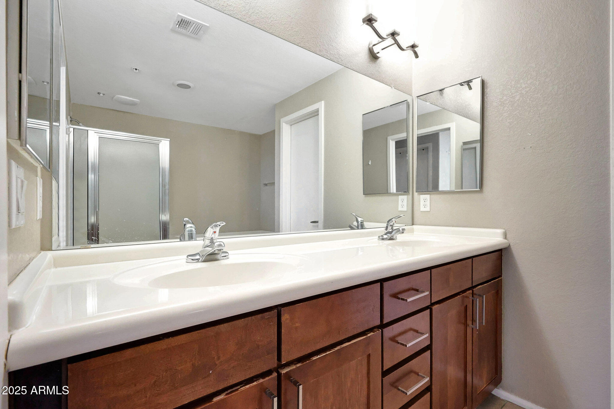 6605 North 93RD Avenue, Unit 1067 Glendale, AZ 85305 - Photo 15 of 47 a bathroom with a sink and a mirror