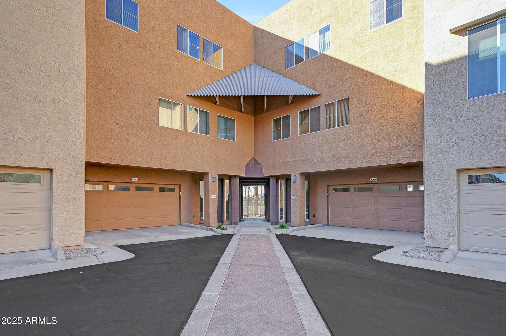 6605 North 93RD Avenue, Unit 1067 Glendale, AZ 85305 - Photo 2 of 47 a front view of a house with yard