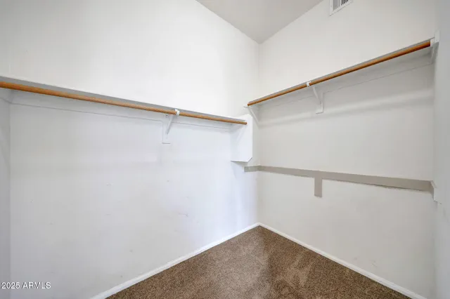 a view of an empty walk in closet