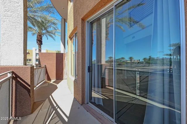 a view of a balcony with chairs