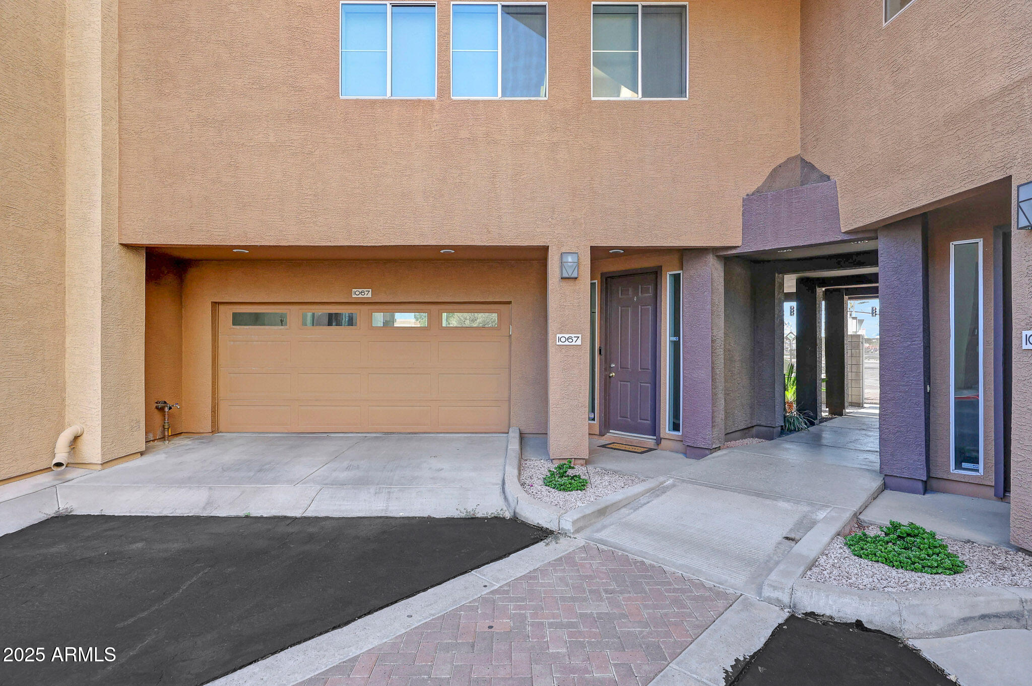 6605 North 93RD Avenue, Unit 1067 Glendale, AZ 85305 - Photo 3 of 47 a front view of a house with garden