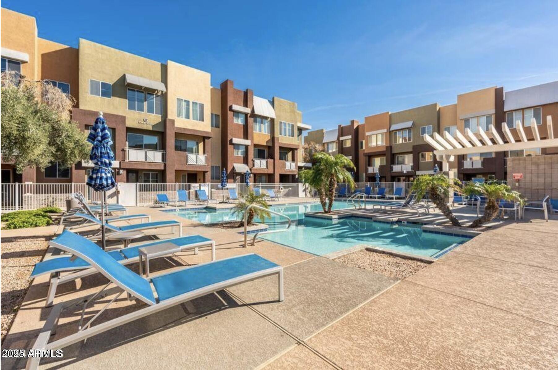 6605 North 93RD Avenue, Unit 1067 Glendale, AZ 85305 - Photo 35 of 47 a view of a building with garden and sitting area