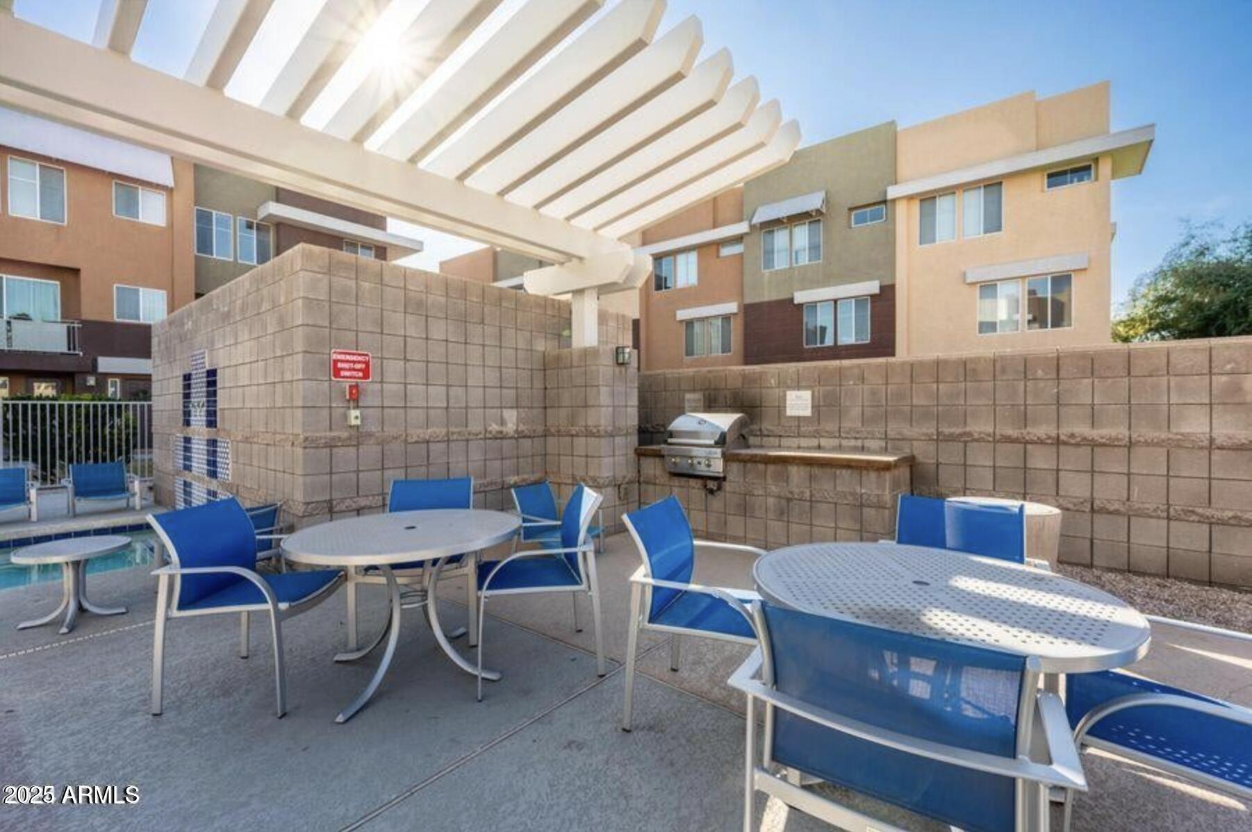 6605 North 93RD Avenue, Unit 1067 Glendale, AZ 85305 - Photo 37 of 47 a view of a dinning tables and chairs in the patio