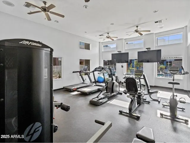 a living room with furniture fireplace and a flat screen tv