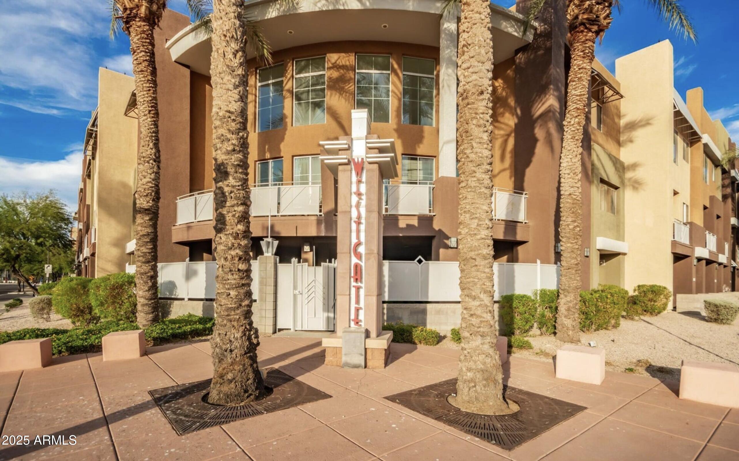 6605 North 93RD Avenue, Unit 1067 Glendale, AZ 85305 - Photo 41 of 47 a front view of a building with street view