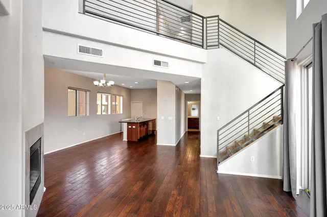 a view of an entryway with wooden floor and stairs
