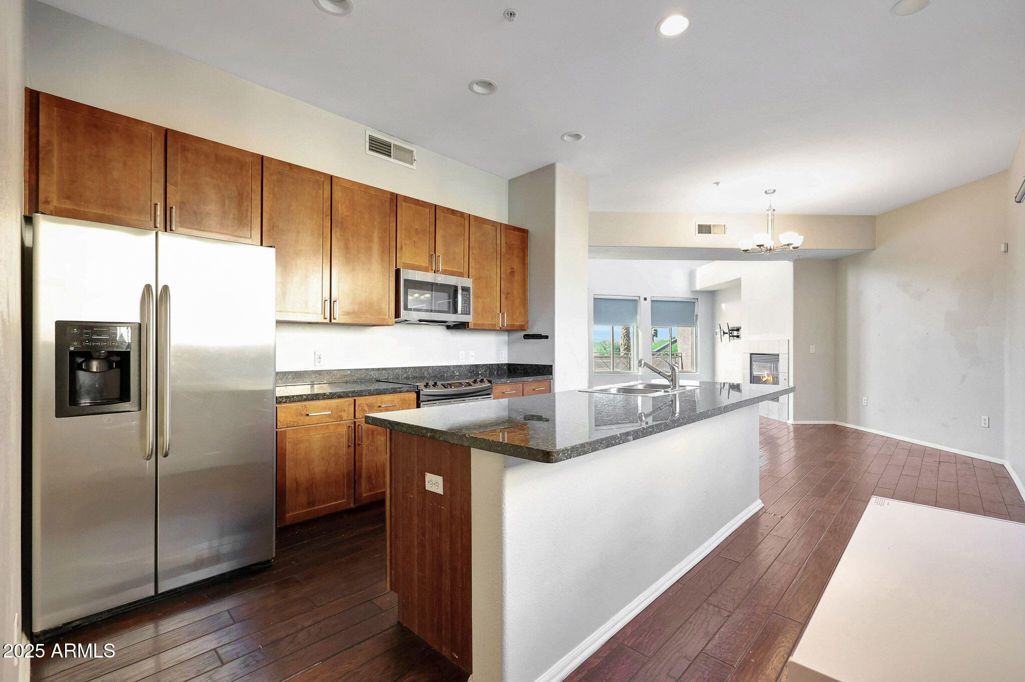 6605 North 93RD Avenue, Unit 1067 Glendale, AZ 85305 - Photo 9 of 47 a kitchen with stainless steel appliances granite countertop a refrigerator a sink a stove and cabinets
