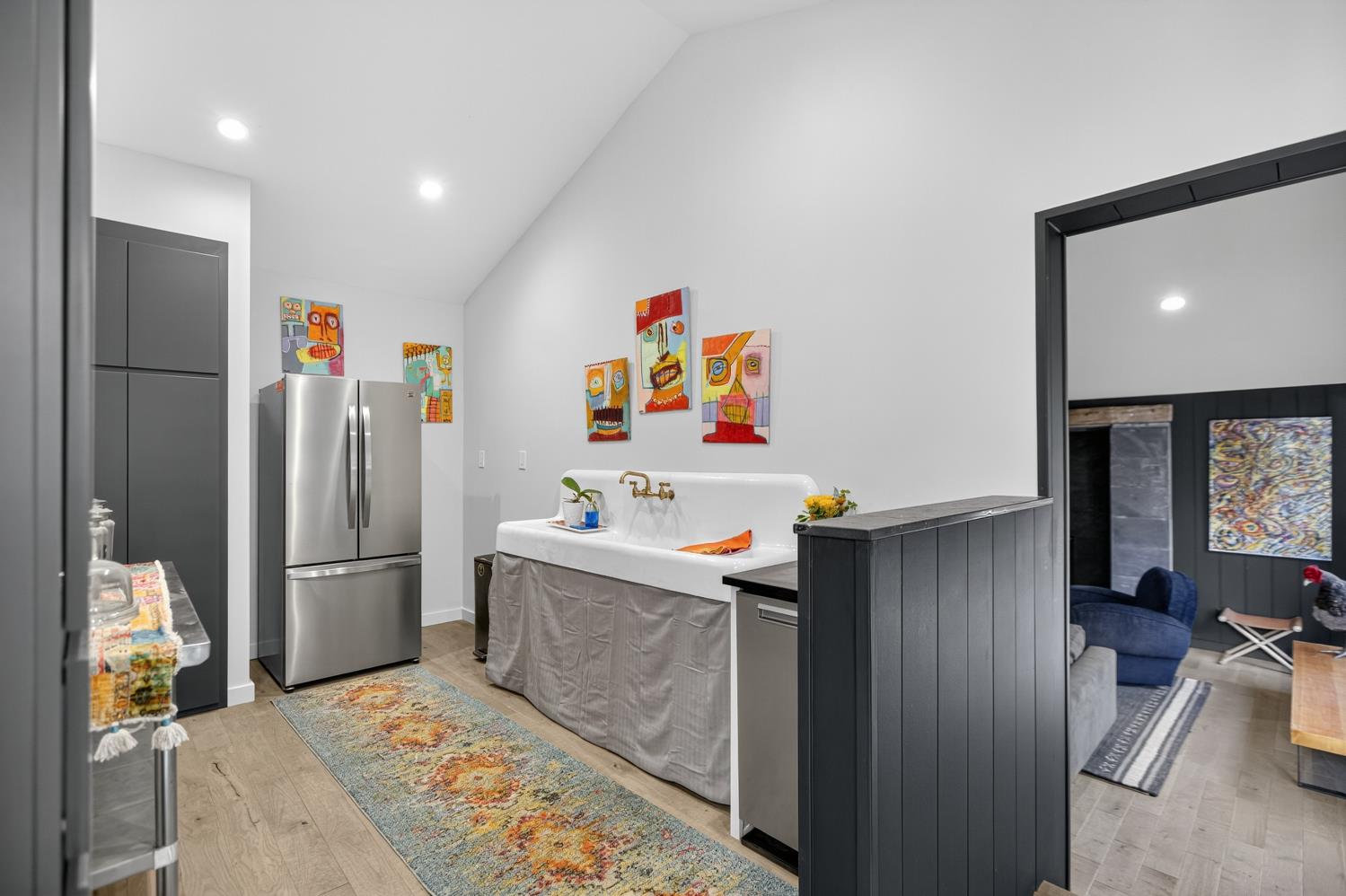 22080 Fiddletown Road Volcano, CA 95689 - Photo 17 of 94 a room with a refrigerator and a flat screen tv