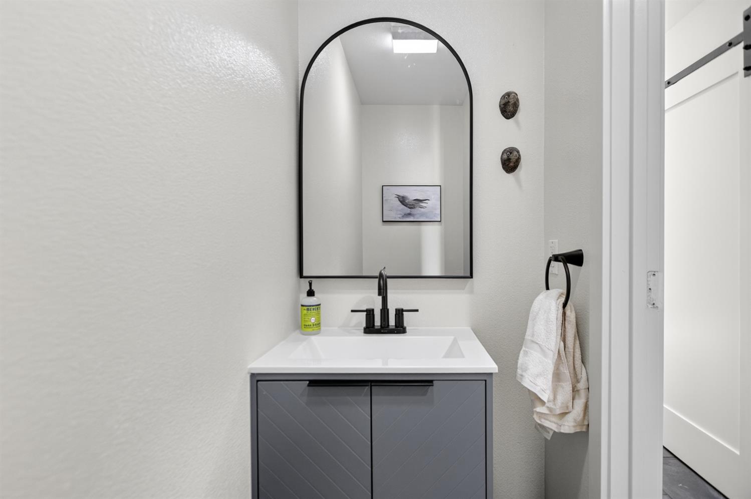 22080 Fiddletown Road Volcano, CA 95689 - Photo 28 of 94 a bathroom with a sink and a mirror