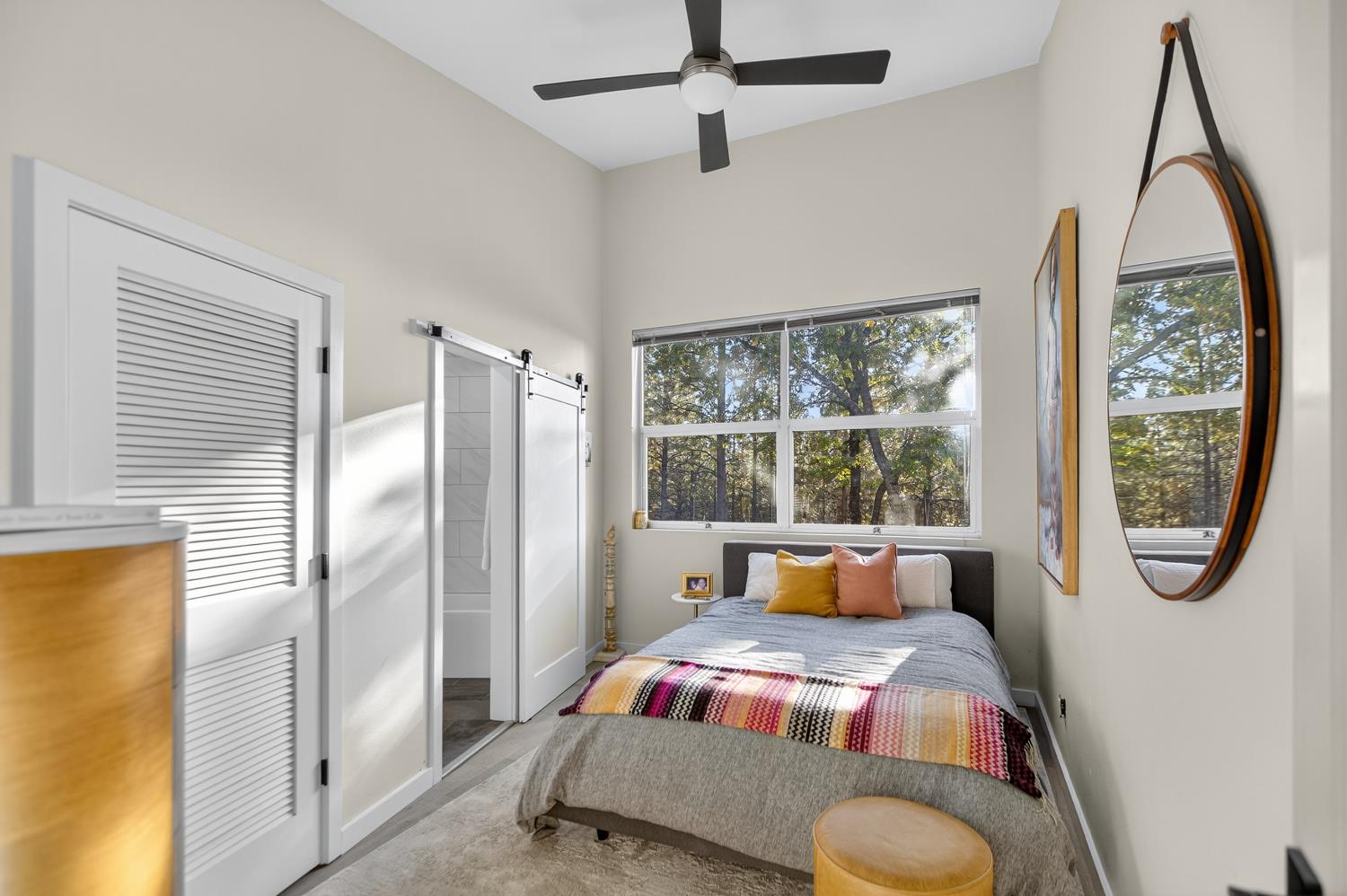 22080 Fiddletown Road Volcano, CA 95689 - Photo 29 of 94 a bedroom with a bed next to a window with outer view