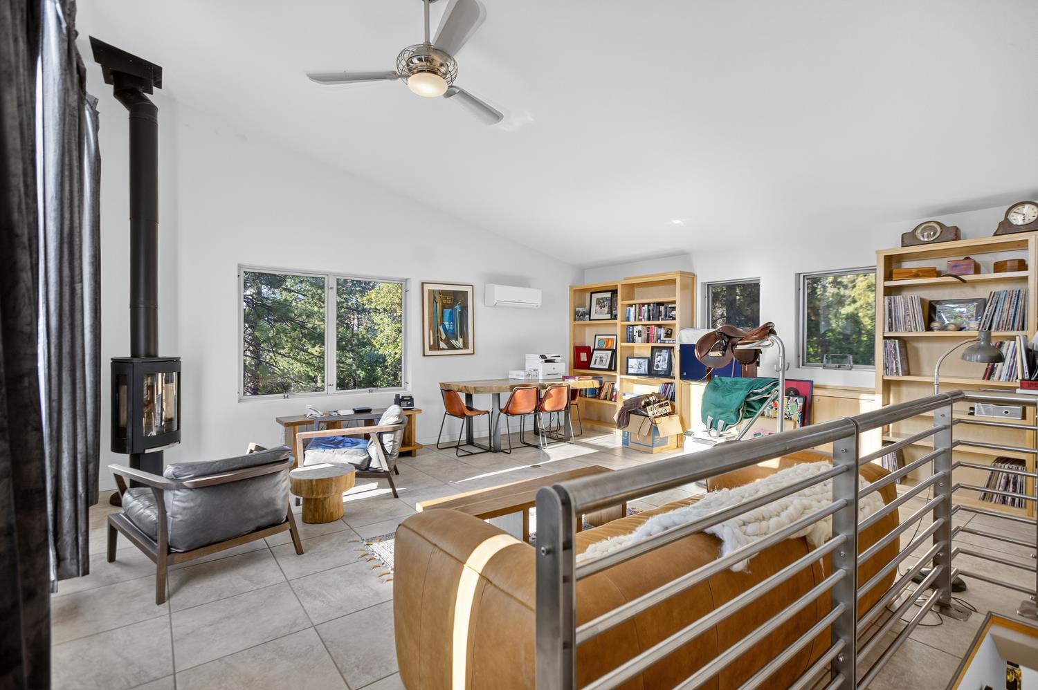 22080 Fiddletown Road Volcano, CA 95689 - Photo 48 of 94 a living room with furniture and a floor to ceiling window