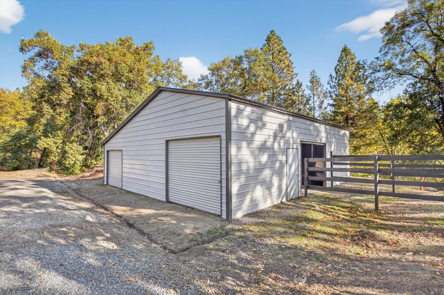 22080 Fiddletown Road Volcano, CA 95689 - Photo 56 of 94 a view of a house with a yard and garage