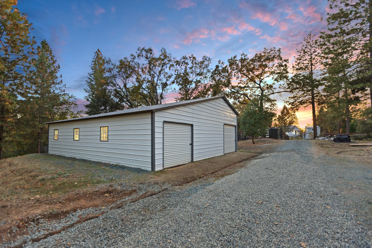 22080 Fiddletown Road Volcano, CA 95689 - Photo 6 of 94 a view of a house with a yard and garage