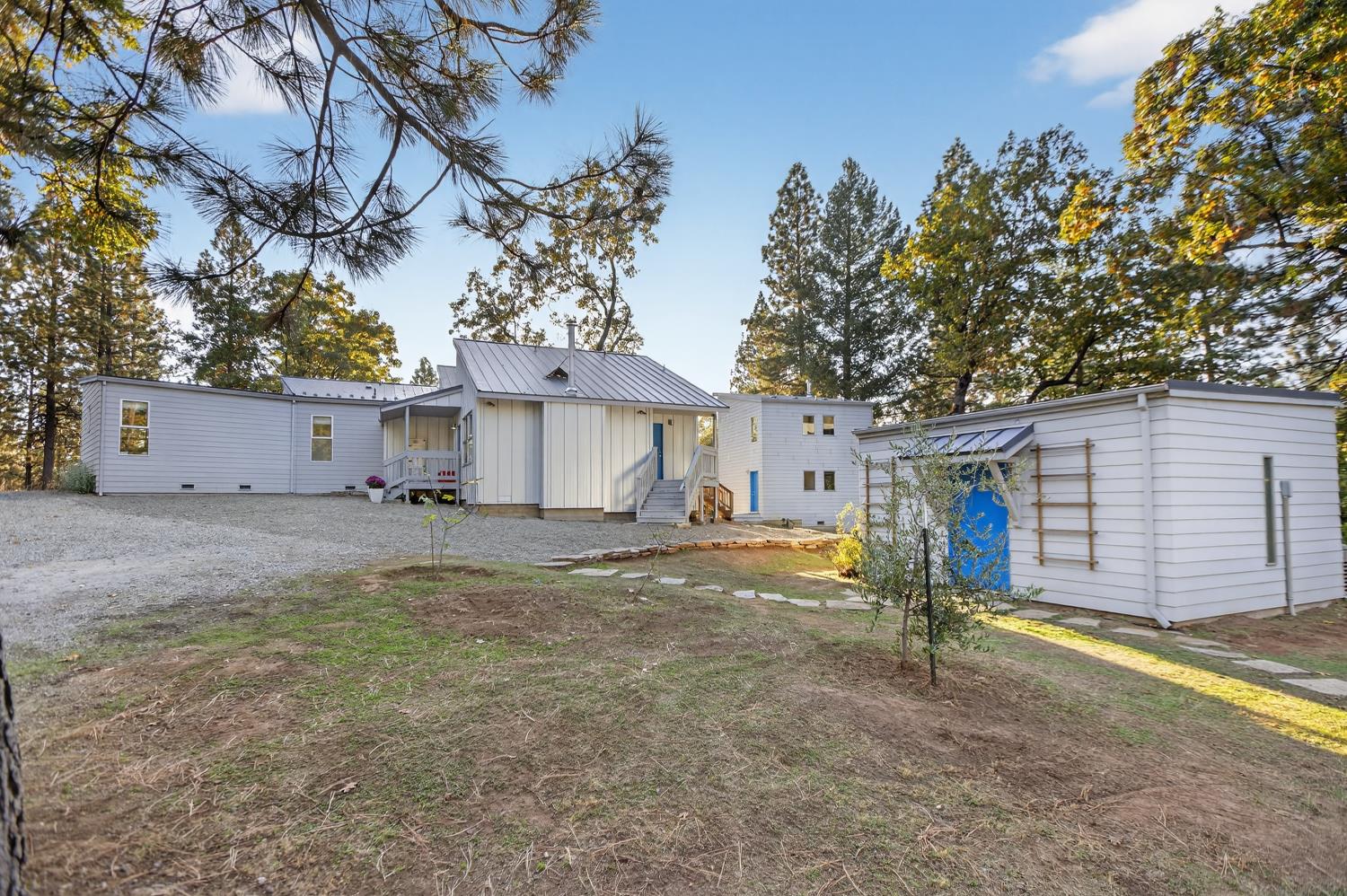 22080 Fiddletown Road Volcano, CA 95689 - Photo 7 of 94 a view of a house with a yard and garage